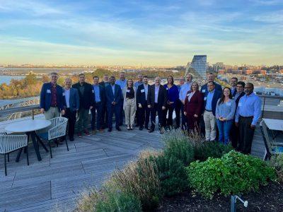 People stand on roof for group photo